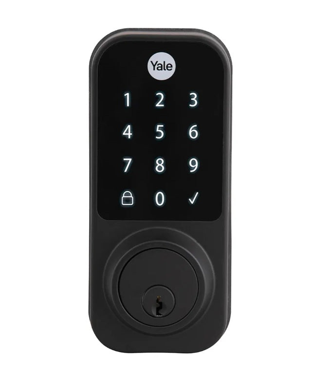 "Vista frontal del cerrojo digital Yale YDD120 en acabado negro mate con teclado táctil iluminado y cilindro para llave física de respaldo."